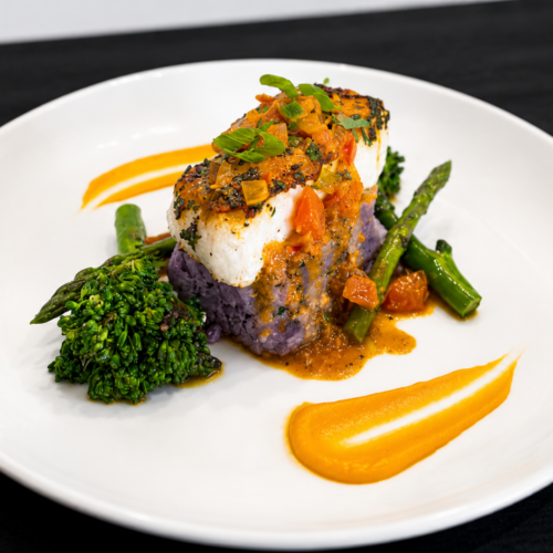 Enjoy seared Chilean sea bass with fresh tomato sofrito, lemon and herbs. A flavorful Pritikin seafood recipe featuring bright Mediterranean-inspired flavors.